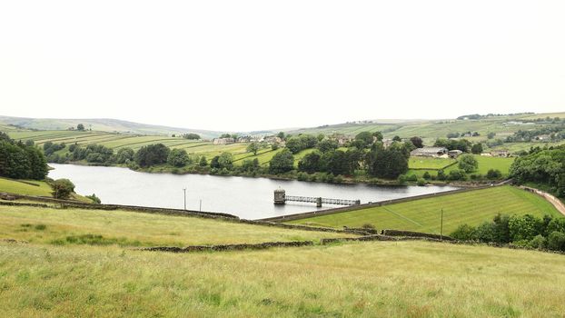 A view across the West Yorkshire countryside towards Lower Raithe Reservoir.  The reservoir is a short distance from the village of Haworth in northern England.