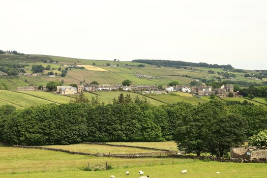 The view across countryside towards the village of Stanbury in the parish of Haworth, West Yorkshire in Northern England.