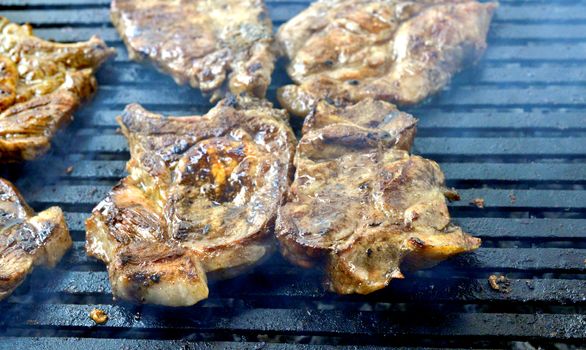 grilling meat meat on a coal barbeque image