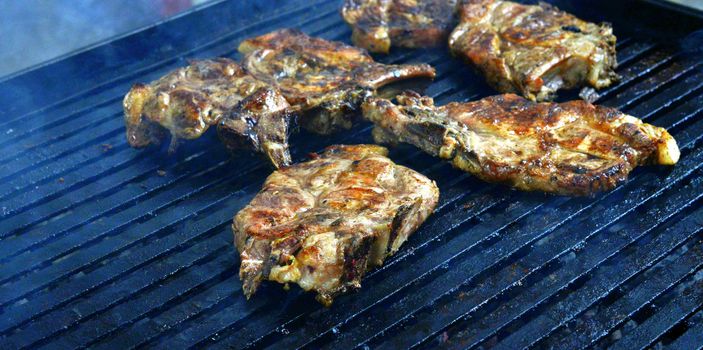 grilling meat meat on a coal barbeque image