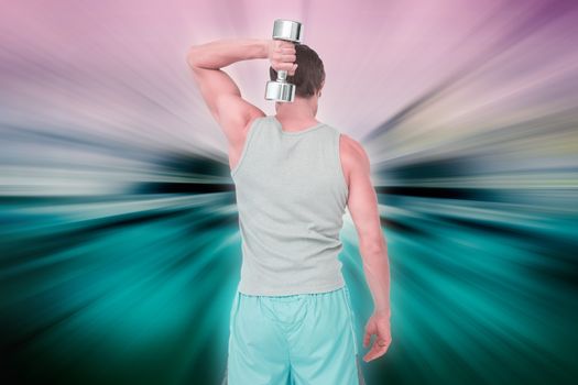 Rear view of a man exercising with dumbbell against abstract background