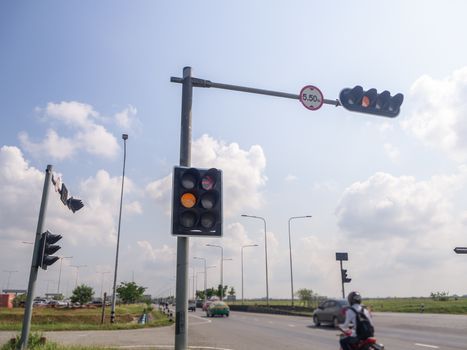 the traffic lights against a vibrant blue sky