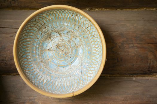 Typical ethnic porcelain bowl with floral and ornamentic pattern. Traditional souvenir from Belarus.