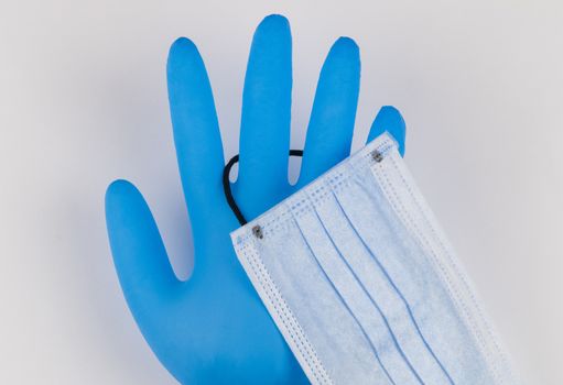 Medical masks and gloves on a white background. Coronavirus Protection Concept