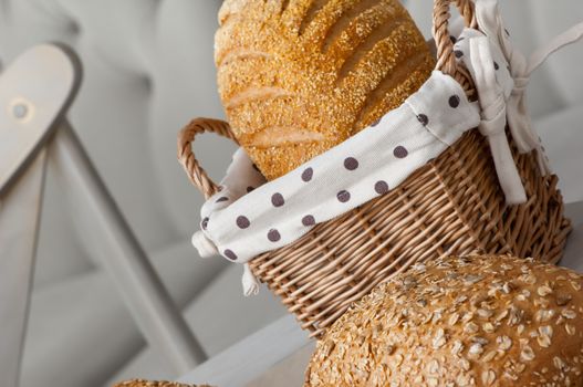 bread in a wicker basket on a light background on a table