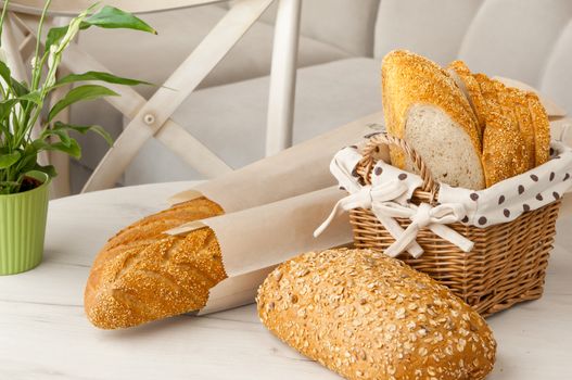 bread in a wicker basket on a light background on a table