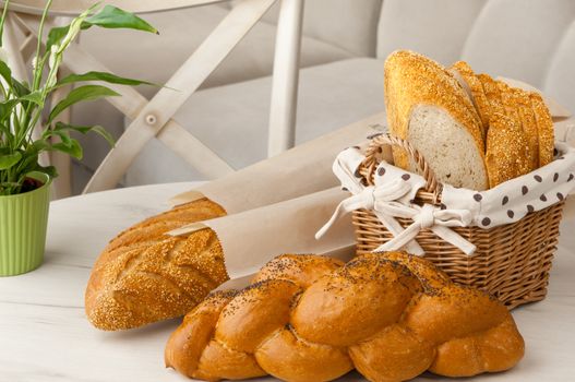 bread in a wicker basket on a light background on a table