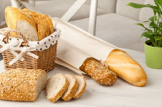 bread in a wicker basket on a light background on a table