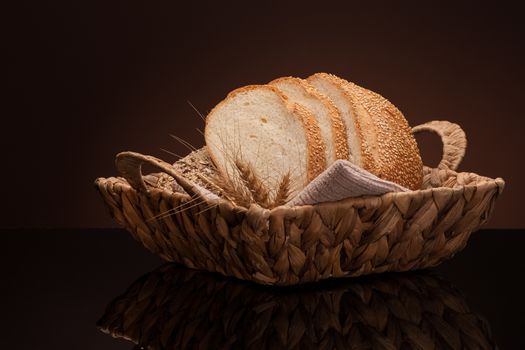 bread in a wicker basket on a dark background