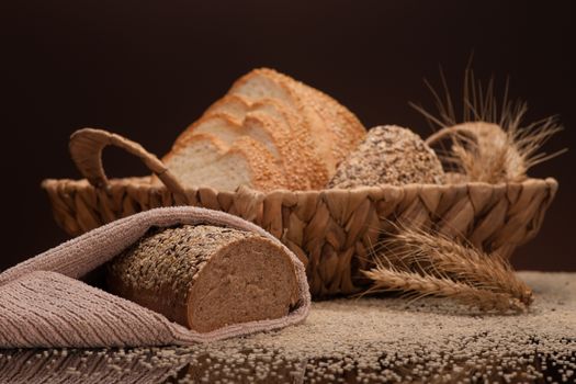bread in a wicker basket on a dark background
