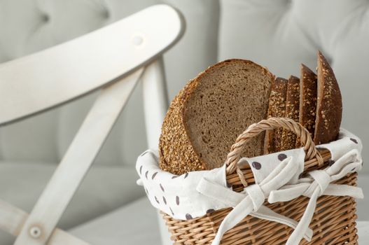 bread in a wicker basket on a light background on a table