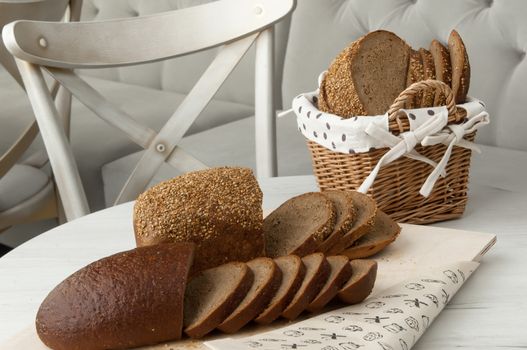 bread in a wicker basket on a light background on a table