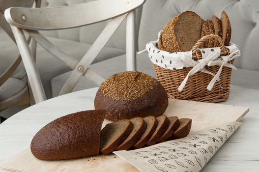 bread in a wicker basket on a light background on a table