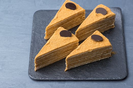 appetizing cake on a black plate