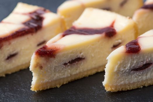 appetizing cake on a black plate, close-up