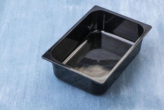 black empty plastic container for ice cream, top view