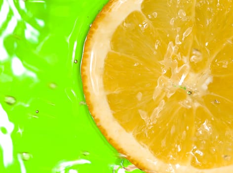 orange slice in green water with waves