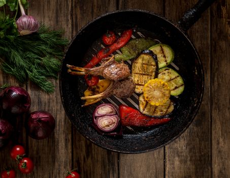 in a pan roast the meat bones and vegetables, top view