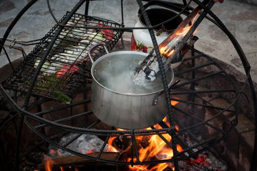 preparation of soup and fish at the stake