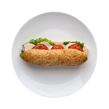 hot dog with tomato in a plate on a white background, top view