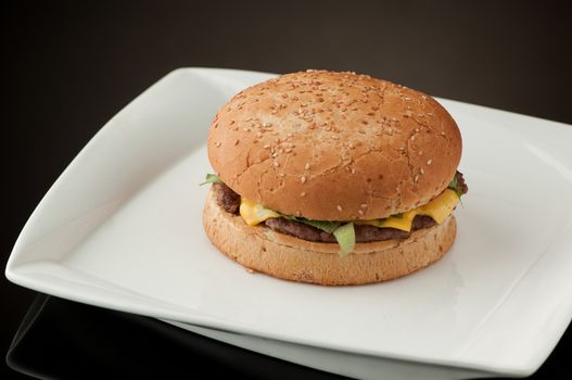 hamburger in a white square plate