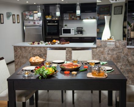 served table with food and sausages in the home kitchen