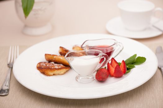 breakfast served with toast with strawberries and milk