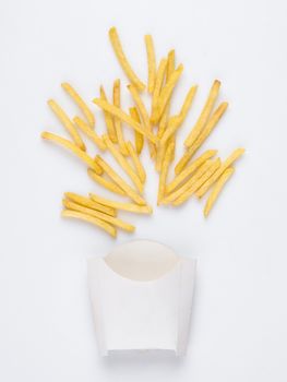 on a white background fried french fries in a white box. studio photo of fried french fries on white background