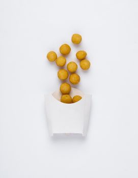 fried chicken balls in a white box on a white background. studio picture of fried chicken balls