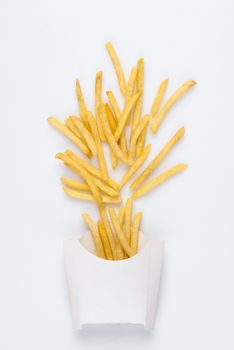 on a white background fried french fries in a white box. studio photo of fried french fries on white background