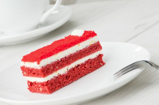 cake with a fork on a plate on a table closeup