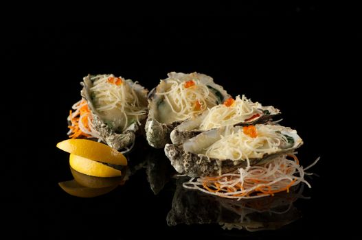 seafood and mussels in a shell with melted cheese and lemon slices on a black background with reflection. mussels in a shell with salad on a dark background