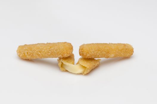 cheese in bread crumbs close up on a white background