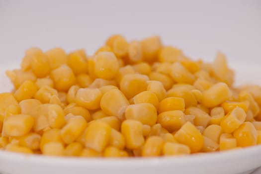 boiled corn close-up on a light background