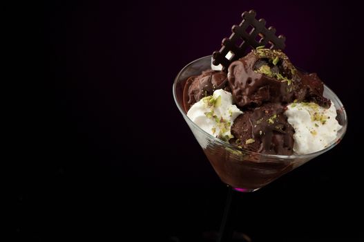 Ice cream in a vase on a dark background