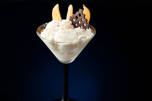 Ice cream in a vase on a dark background