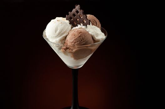 Ice cream in a vase on a dark background