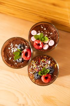 Top view group shot of glasses filled with delicious mousse chocolate