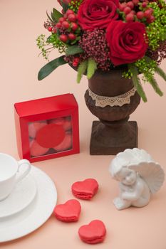 cookies red heart shaped gift box decorated with flowers and an angel on Valentine's Day