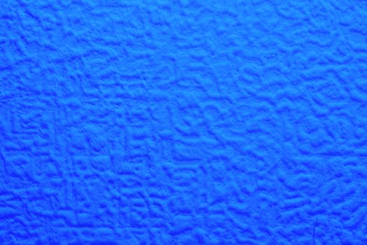 blue foam texture with uneven wavy surface, full frame, close up