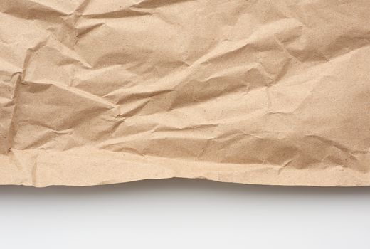 piece of crumpled blank sheet of brown wrapping paper. Grunge texture. kraft paper texture.