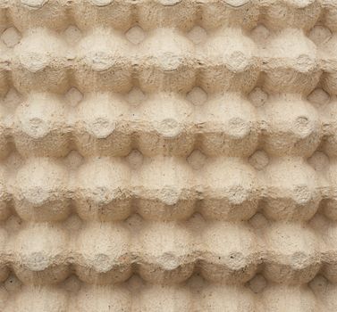 volumetric texture of a beige paper egg tray, full frame, close up