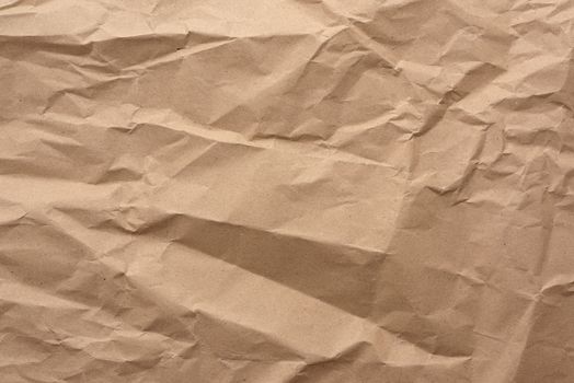 fragment of crumpled blank sheet of brown wrapping kraft paper, vintage texture for the designer, full frame