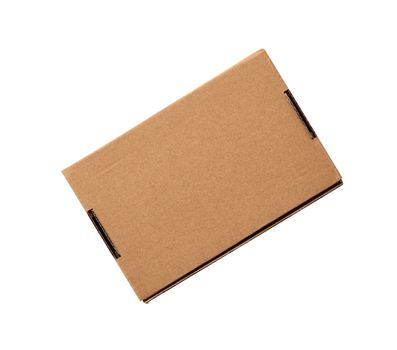closed rectangular small brown box for transporting goods isolated on a white background, top view. Blank cardboard storage box