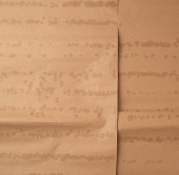 crumpled brown sheet of paper for packaging goods, close up