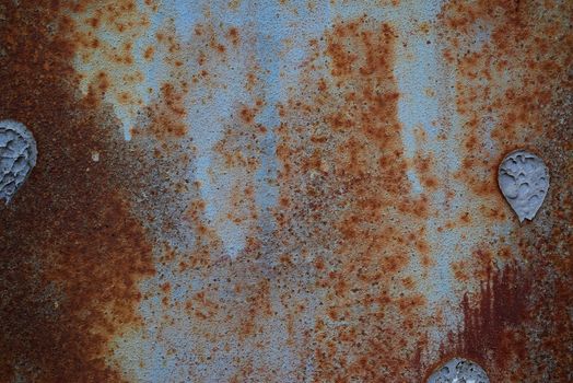 brown iron texture of rusty sheet with remains of blue paint. Metal rusty texture background rust steel.