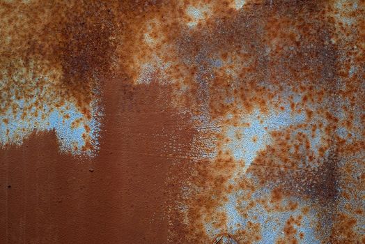 Metal rusty texture background rust steel. Dirt effect. Blue background.