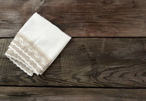 white napkin, kitchen wooden background in vintage style, copy space