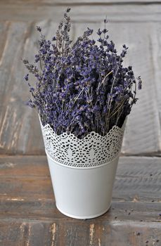 Fragrant dried lavender in white vase