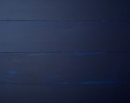 Dark blue wooden texture background.  Wooden table.